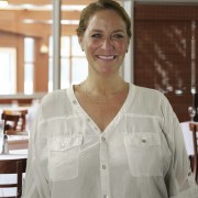 Smiling woman with brown hair pulled back